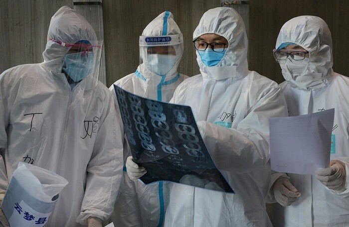 Trung Quốc: Số người chết vì dịch Covid-19 giảm kỷ lục, nhiều nơi hạ mức ứng phó khẩn cấp